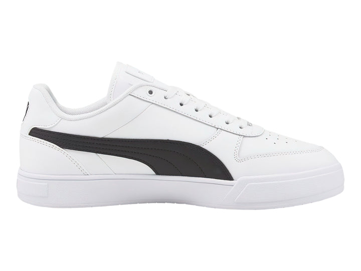 Tenis PUMA Caven Dime en color blanco con franja lateral negra y suela blanca.