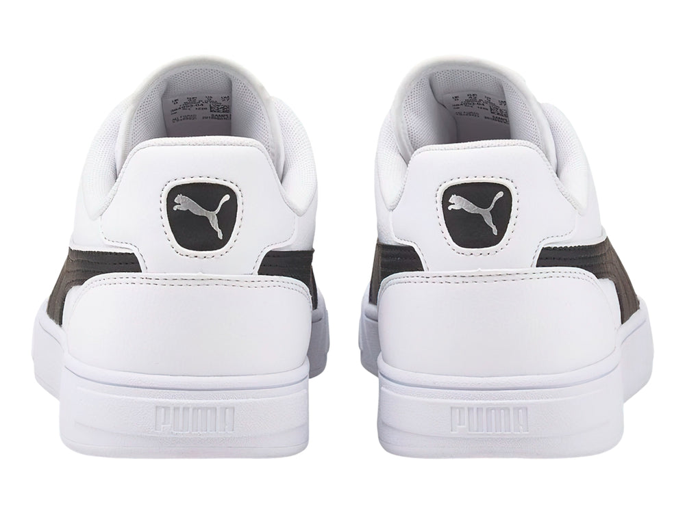 Tenis PUMA Caven Dime en color blanco con franja lateral negra y suela blanca.