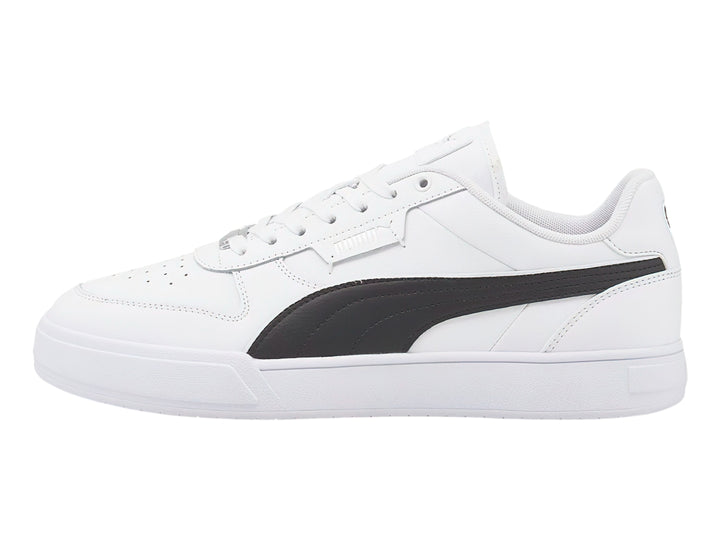 Tenis PUMA Caven Dime en color blanco con franja lateral negra y suela blanca.