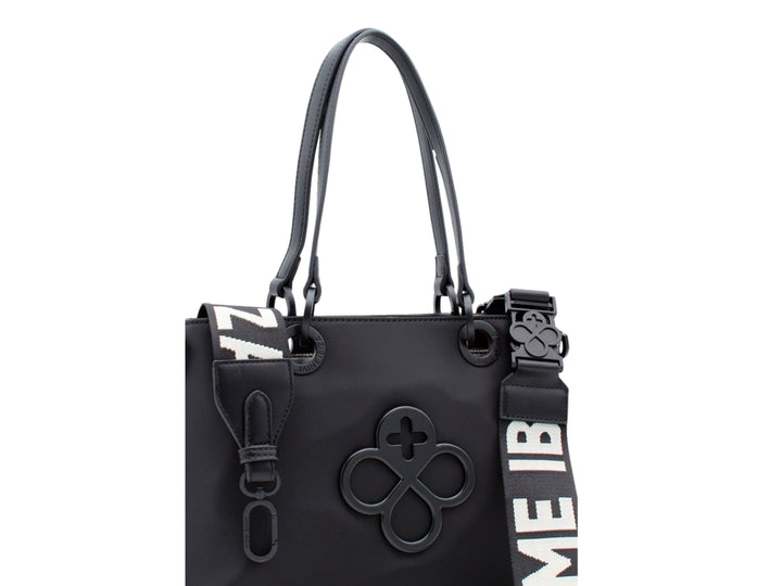 Bolso tote color negro de Jaime Ibiza con asa corta y correa larga ajustable.