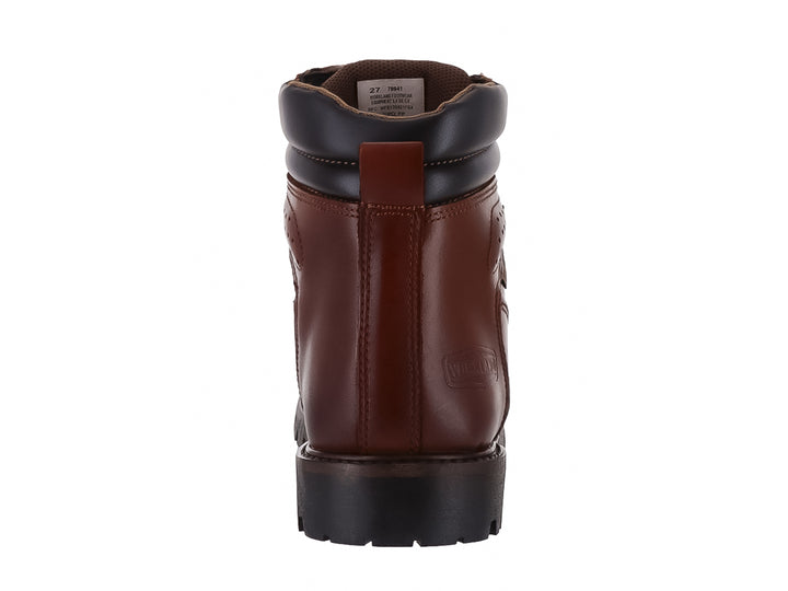 Botín borceguí de cuero color marrón con suela negra y cuello acolchado negro.