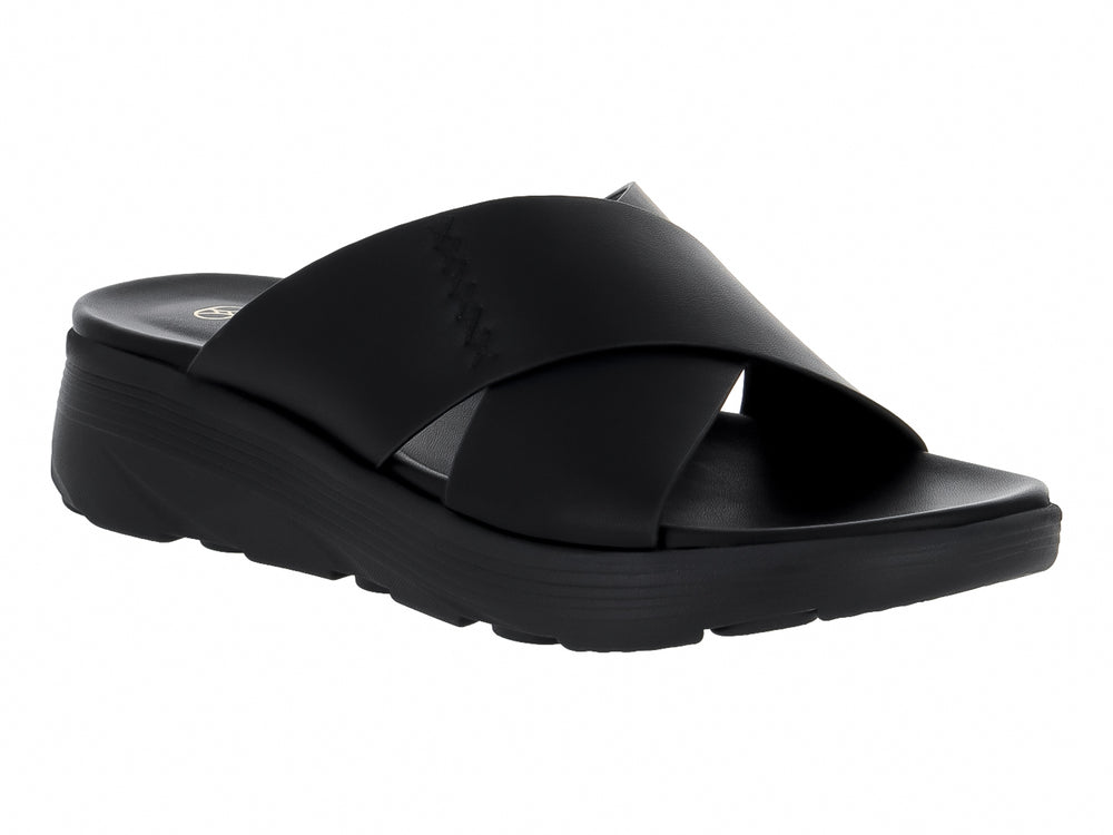 Sandalia negra de plataforma con tiras cruzadas y suela gruesa.