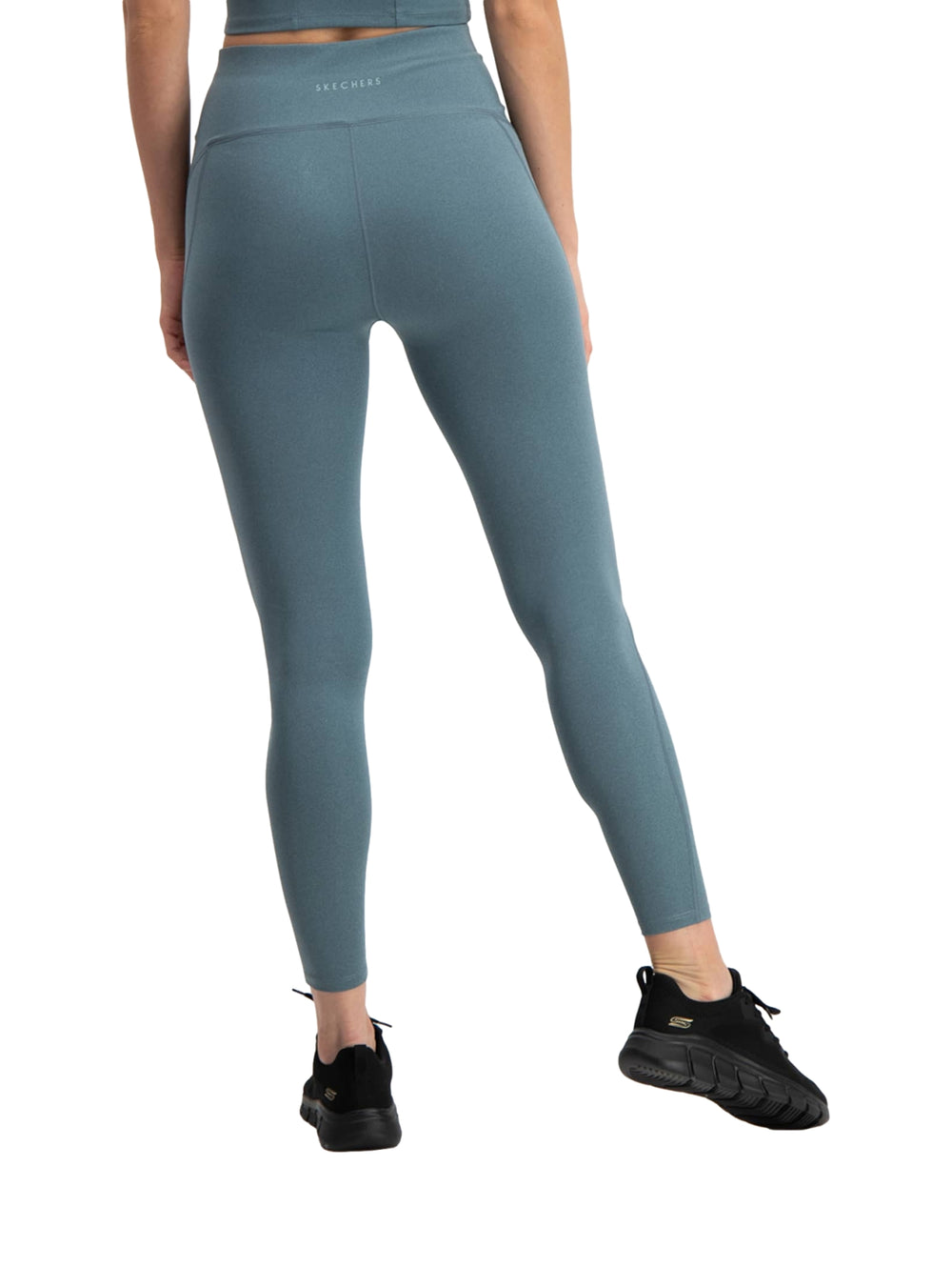 Leggings deportivos ajustados de color verde para mujer marca Skechers.