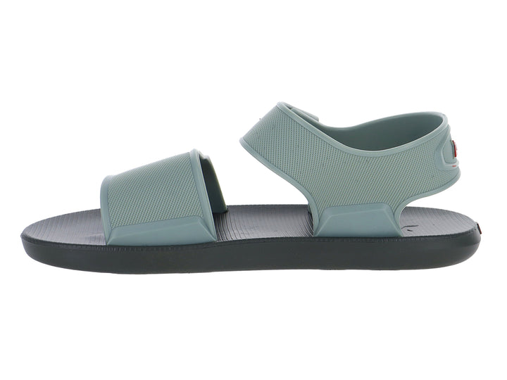 Sandalia infantil Rider de color verde con suela gris oscuro y correas ajustables.