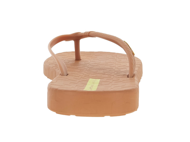 Sandalias tipo flip-flop de color nude con detalles en amarillo.