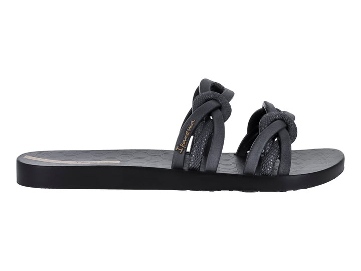 Sandalia slide Ipanema color negro y plata con correas entrelazadas en forma de nudo.