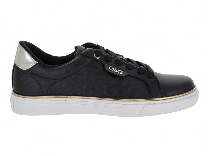 Tenis negros GBG con suela blanca, detalles en dorado y plateado, diseño casual para mujer.