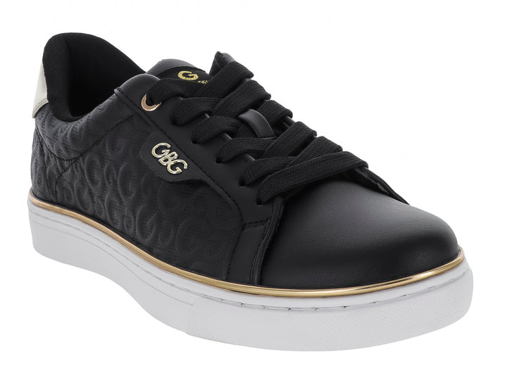 Tenis negros GBG con suela blanca, detalles en dorado y plateado, diseño casual para mujer.