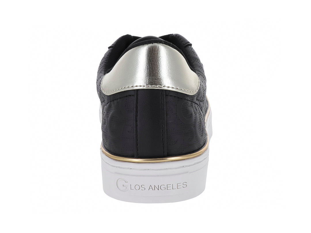 Tenis negros GBG con suela blanca, detalles en dorado y plateado, diseño casual para mujer.