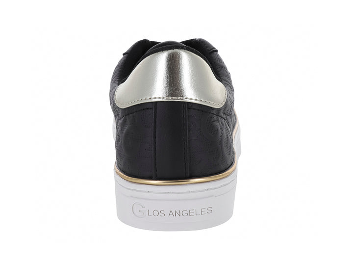 Tenis negros GBG con suela blanca, detalles en dorado y plateado, diseño casual para mujer.