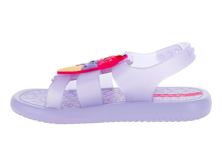 Sandalia infantil Ipanema color violeta lila perlado con adornos coloridos en la correa superior.