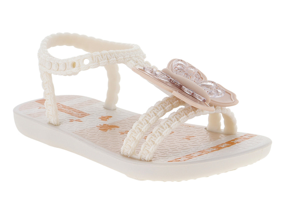 Sandalias para bebé de color beige con adorno de flor y tiras texturizadas.