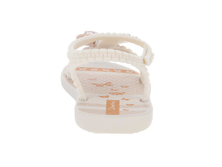 Sandalias para bebé de color beige con adorno de flor y tiras texturizadas.