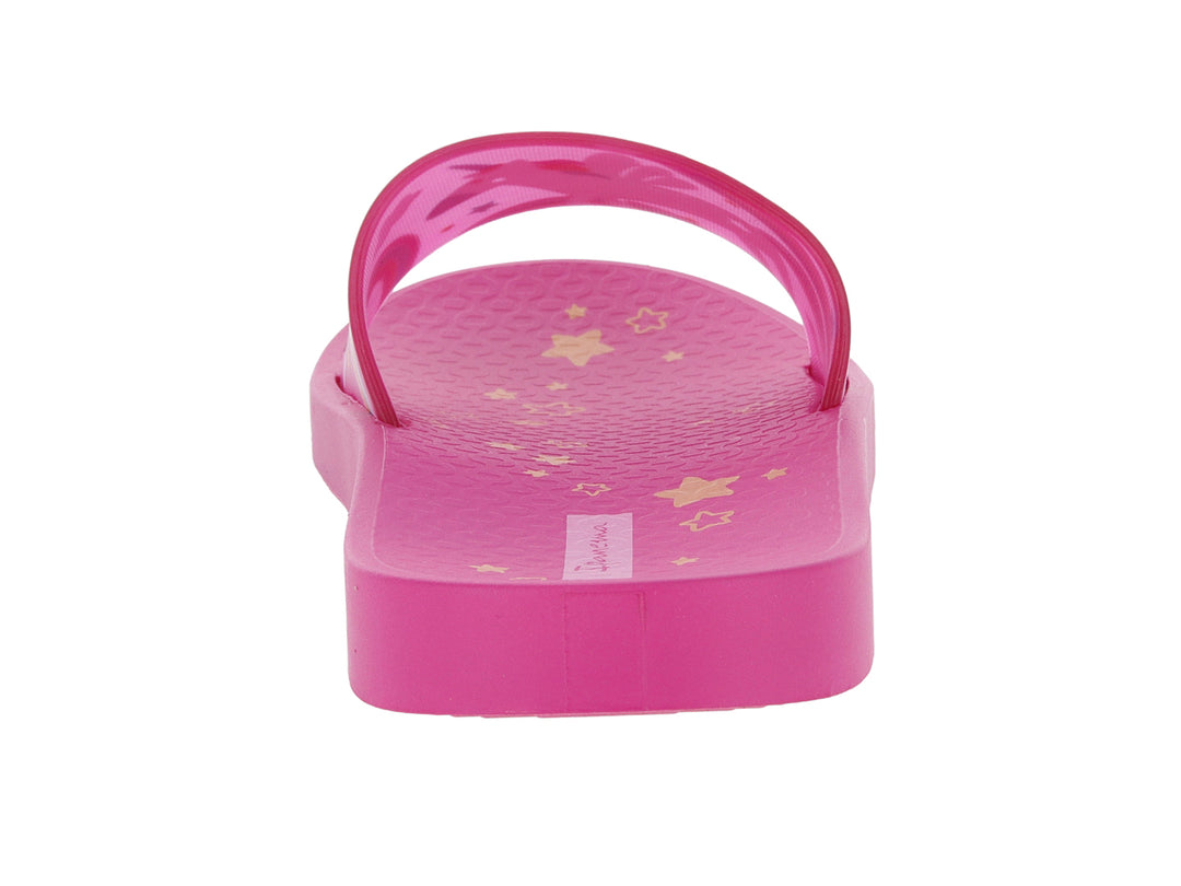 Sandalia slide rosa para niños con estampado de unicornio multicolor en la banda.