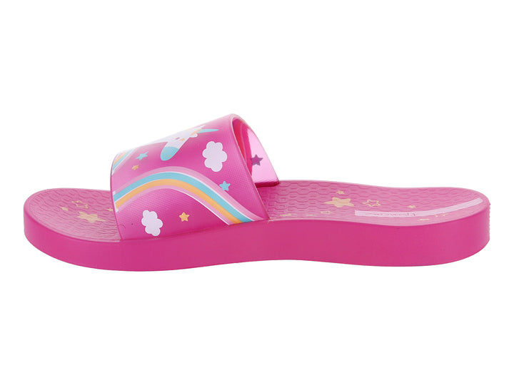 Sandalia slide rosa para niños con estampado de unicornio multicolor en la banda.