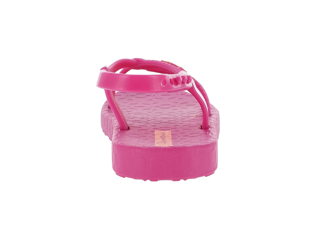 Sandalia rosa para bebé de la marca Ipanema con correa ajustable y suela texturizada.
