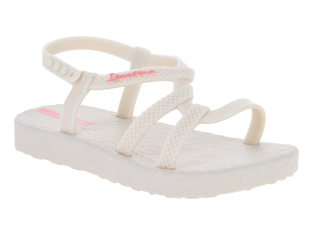 Sandalia para bebé Ipanema color hueso con detalles en rosa y tiras ajustables.