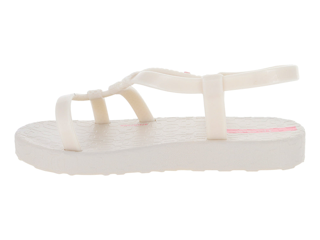 Sandalia para bebé Ipanema color hueso con detalles en rosa y tiras ajustables.