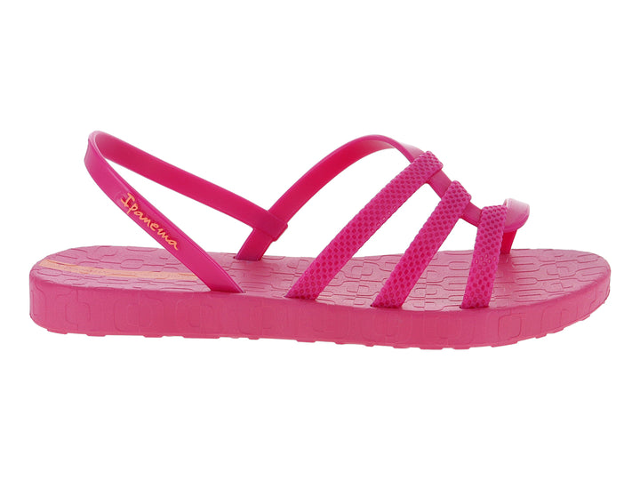 Sandalia infantil Ipanema de color rosa con tiras transversales y detalle en naranja.