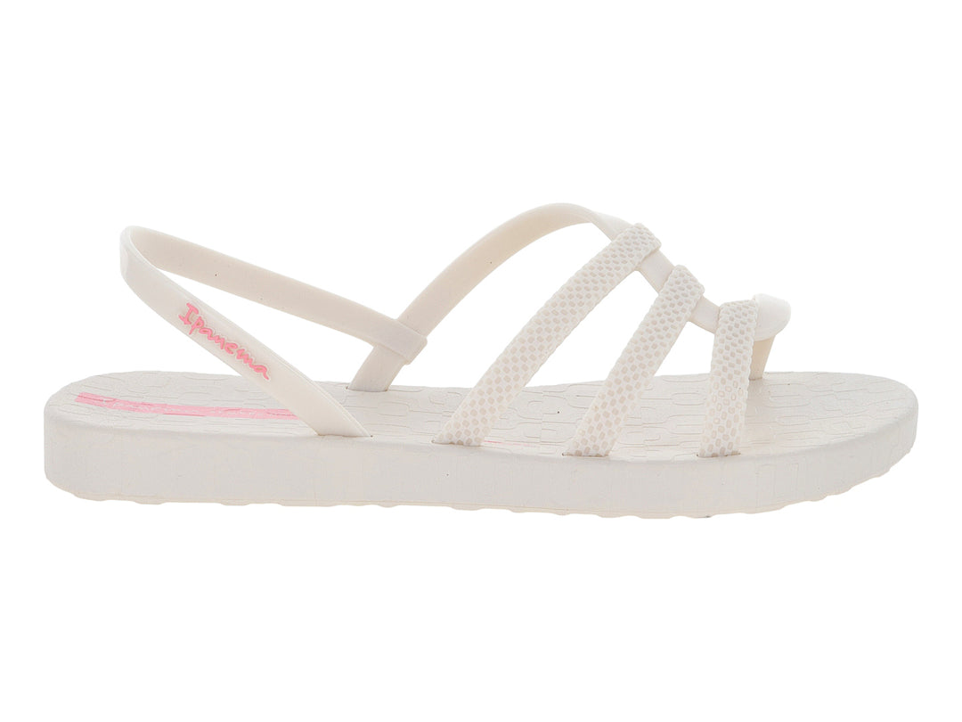 Sandalia infantil Ipanema de color hueso con tiras cruzadas y detalles en rosa.