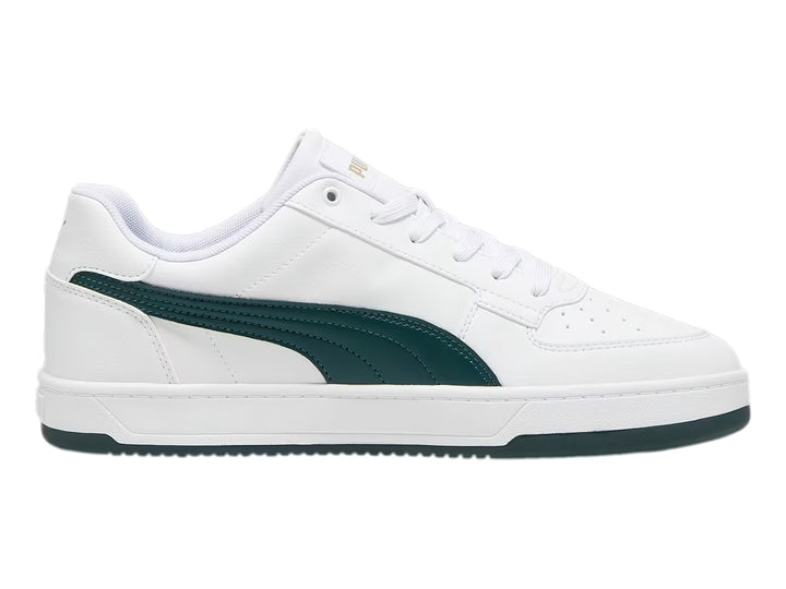 Tenis Puma Caven 2.0 blancos con franja lateral y suela en color verde oscuro.
