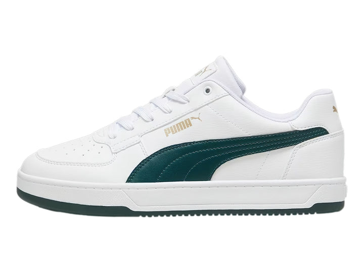 Tenis Puma Caven 2.0 blancos con franja lateral y suela en color verde oscuro.