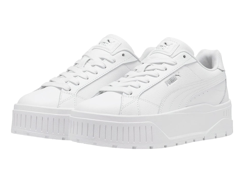 Tenis PUMA Carmen II L en color blanco con suela de plataforma gruesa y detalles en plata.