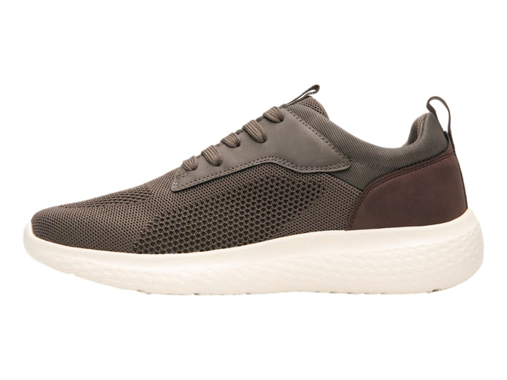 Tenis Flexi color taupe con suela blanca, diseño casual deportivo en malla y sintético.