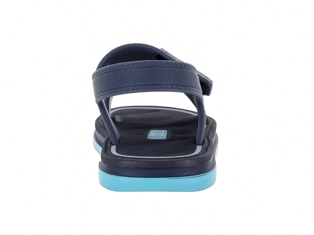 Sandalia infantil Cartago color gris oscuro con suela azul claro y correas ajustables.