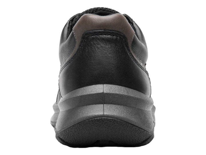Zapato casual Flexi color negro con detalles en marrón y suela gruesa oscura.
