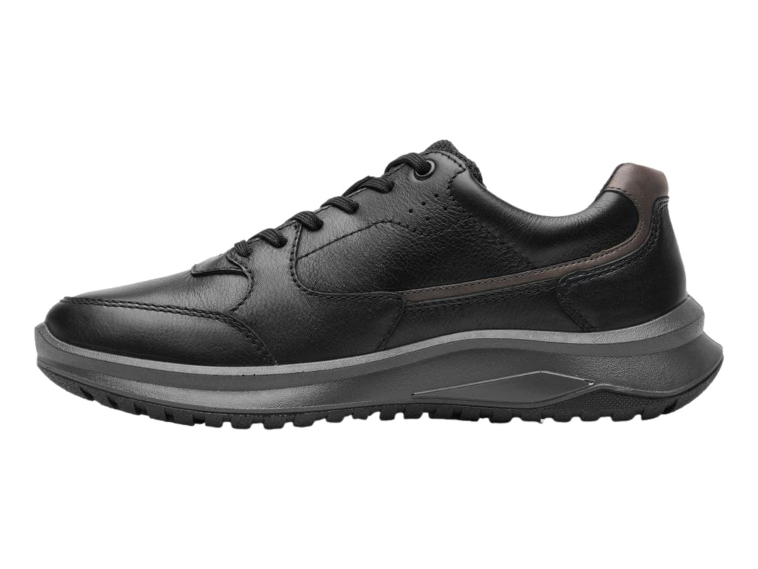 Zapato casual Flexi color negro con detalles en marrón y suela gruesa oscura.