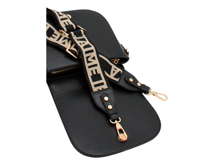 Bolso bandolera negro de Jaime Ibiza con herrajes dorados y logo ornamental en el centro.