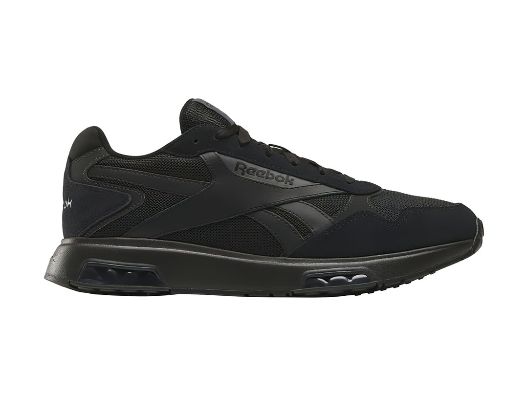 Tenis deportivos Reebok color negro con malla transpirable y suela amortiguada.