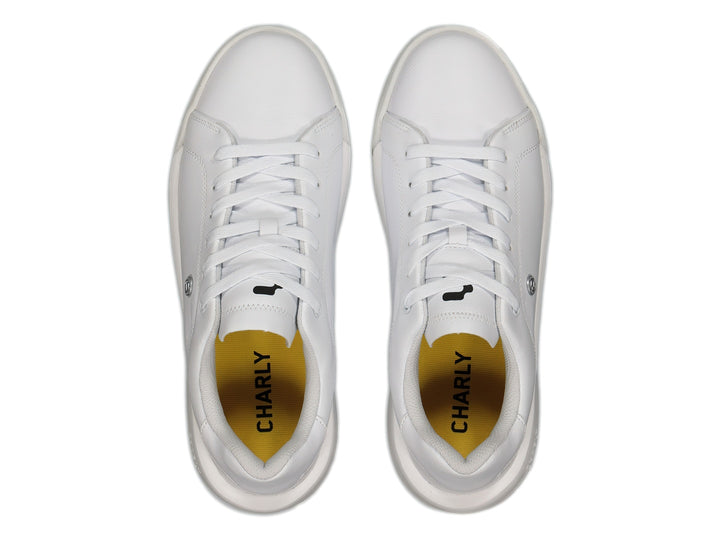Tenis blancos Charly de corte bajo con suela plana y cordones.