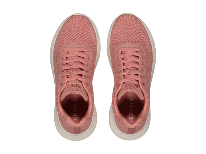Tenis deportivos Charly de color rosa con suela blanca y tejido transpirable.