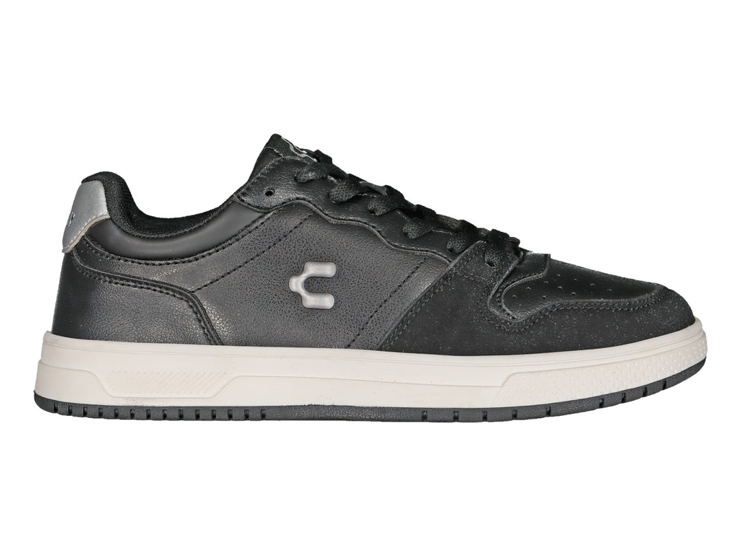 Tenis deportivos Charly color negro con detalles en plata y suela blanca.