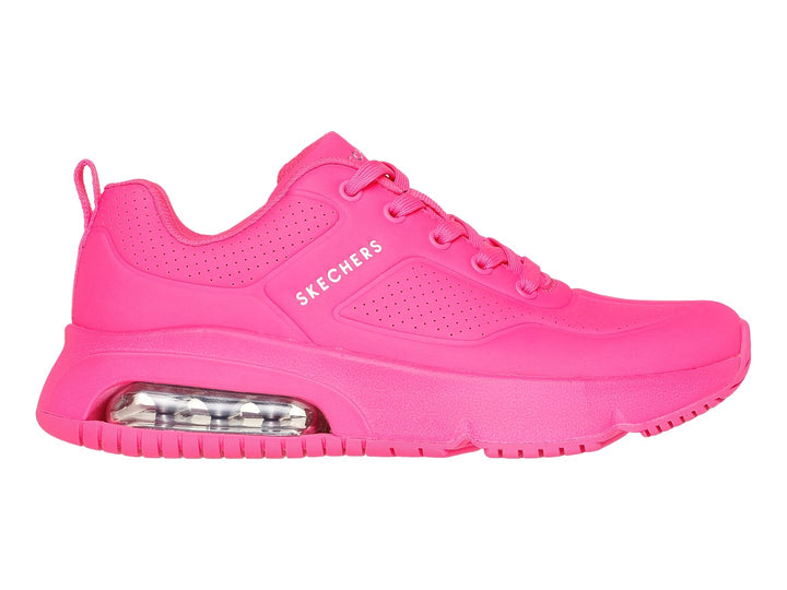 Tenis deportivos Skechers color fucsia con amortiguación de aire visible en la suela.