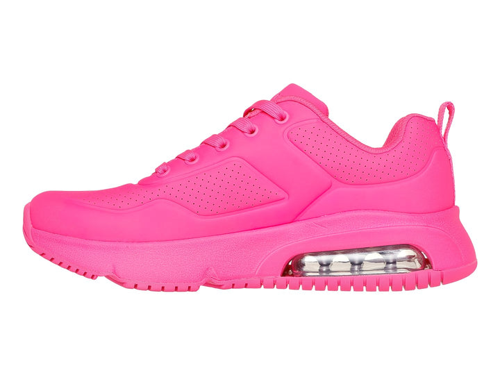 Tenis deportivos Skechers color fucsia con amortiguación de aire visible en la suela.