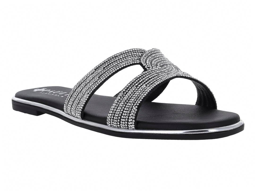 Sandalia plana color negro para mujer con tiras decoradas con brillos plateados y suela delgada.