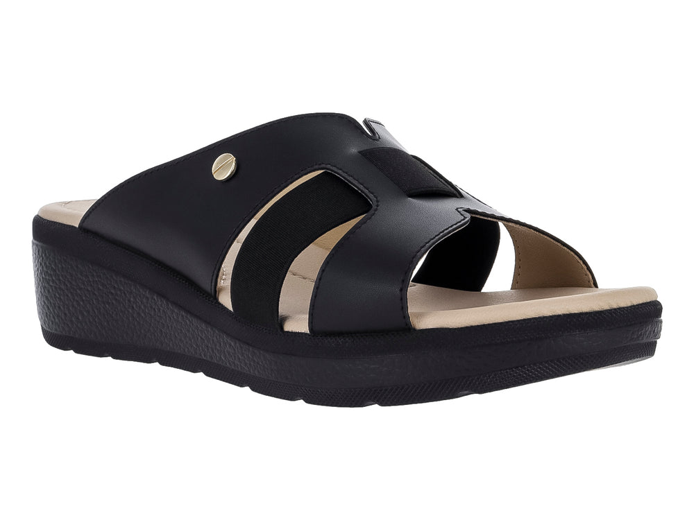 Sandalia de plataforma color negro con tiras cruzadas y suela gruesa.