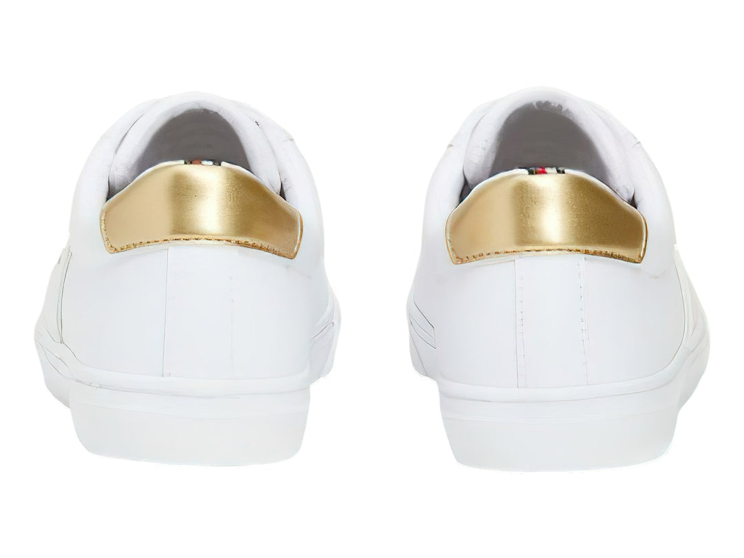 Tenis blancos de Tommy Hilfiger con detalles dorados en el talón y laterales.