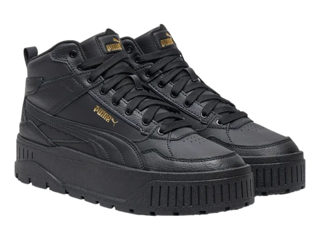 Tenis PUMA Carmen II Idol Mid en color negro con detalles dorados y suela de plataforma gruesa.
