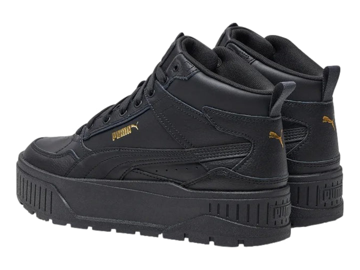 Tenis PUMA Carmen II Idol Mid en color negro con detalles dorados y suela de plataforma gruesa.