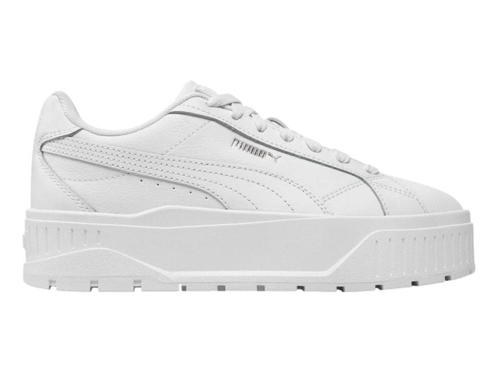 Tenis PUMA blancos con suela de plataforma gruesa y detalles plateados.