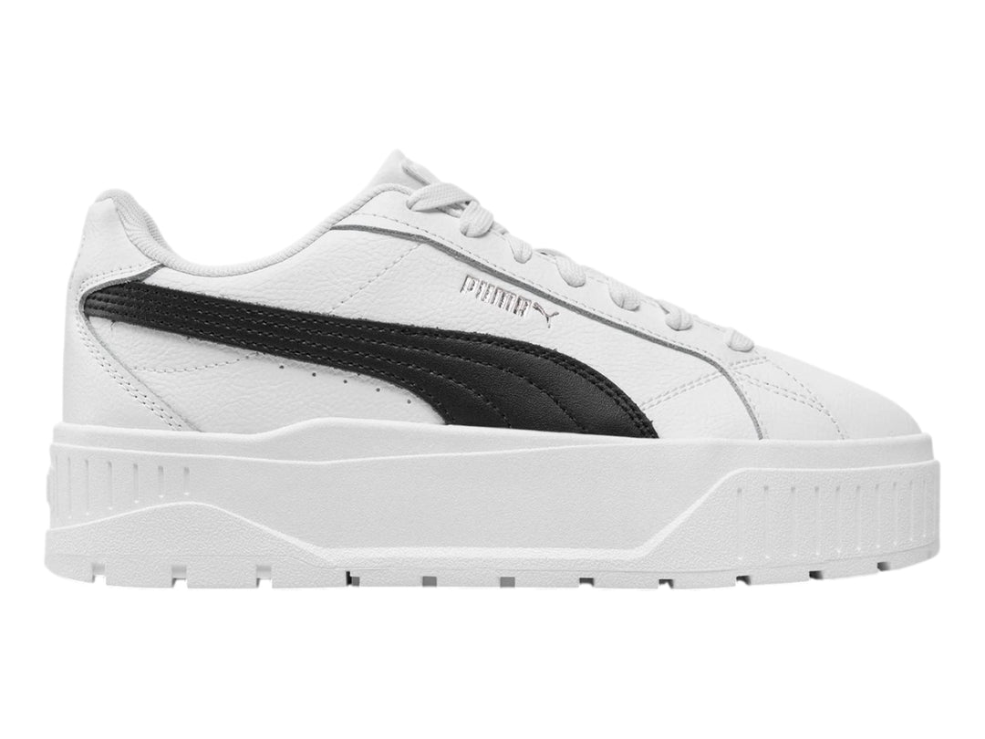 Tenis PUMA Carmen II JR en color blanco con franja lateral negra y suela de plataforma blanca.