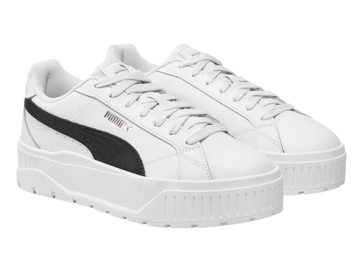 Tenis PUMA Carmen II JR en color blanco con franja lateral negra y suela de plataforma blanca.