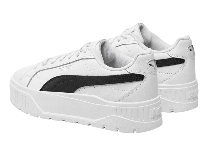 Tenis PUMA Carmen II JR en color blanco con franja lateral negra y suela de plataforma blanca.
