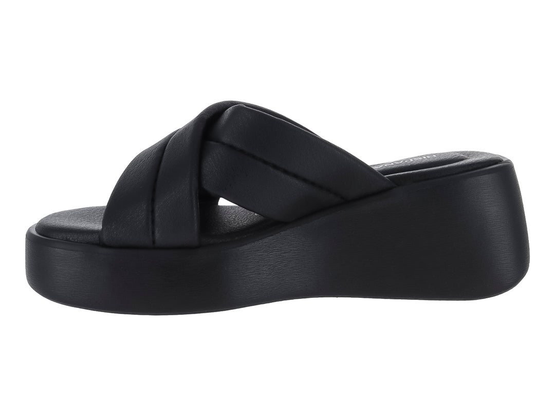 Sandalia de plataforma color negro con tiras cruzadas.