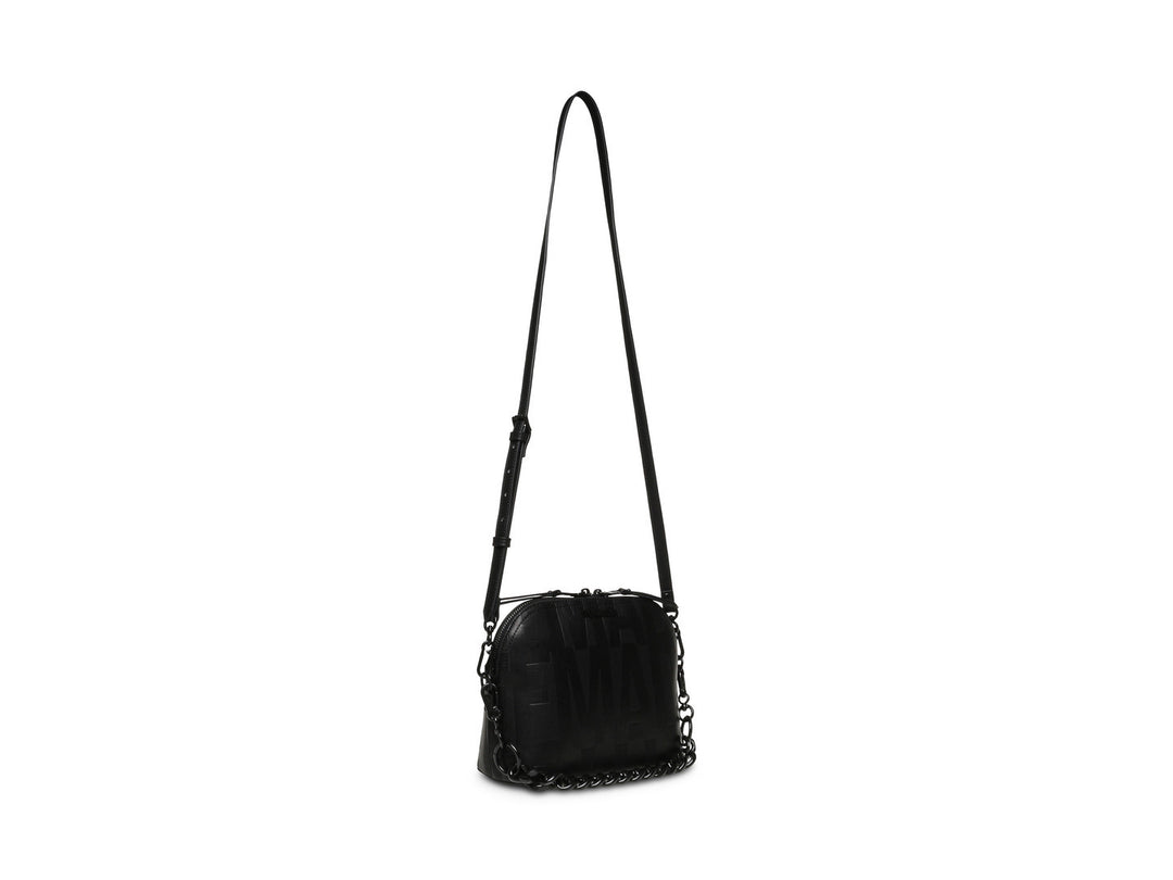 Bolso bandolera negro de Steve Madden con correa larga y detalles de cadena.