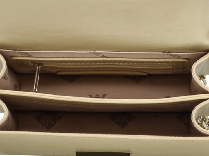 Bolso dorado Steve Madden con correa de cadena y adornos de cristales brillantes.